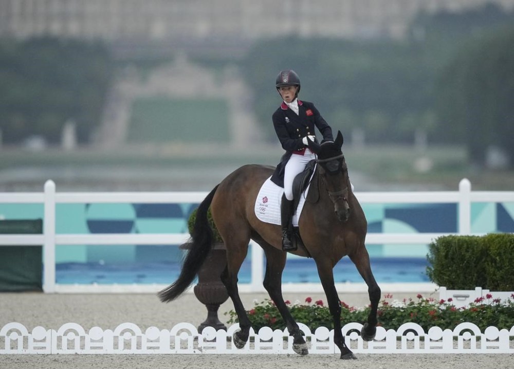 Britain's Rosalind Canter and her horse Lordships Graffalo during the Equestrian Eventing Dressage competition, at the 2024 Summer Olympics, Saturday, July 27, 2024, in Versailles, France. (AP Photo/Mosa'ab Elshamy)