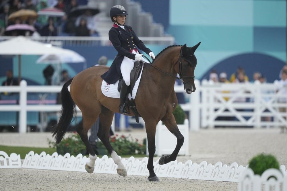 Britain's Laura Collett and her horse London 52 during the Equestrian Eventing Dressage competition, at the 2024 Summer Olympics, Saturday, July 27, 2024, in Versailles, France. (AP Photo/Mosa'ab Elshamy)