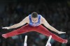 Paul Juda, of United States, competes on the parallel bars during a men's artistic gymnastics qualification round at the 2024 Summer Olympics, Saturday, July 27, 2024, in Paris, France. (AP Photo/Francisco Seco)