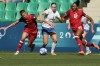 New Zealand's Mackenzie Barry, centre, competes for the ball against Canada's Quinn, left, and Jade Rose during the women's Group A soccer match between Canada and New Zealand at Geoffroy-Guichard stadium during the 2024 Summer Olympics, Thursday, July 25, 2024, in Saint-Etienne, France. Canada's women's soccer takes on host France in Saint-Étienne with its hopes of repeating as Olympic champions in serious doubt. THE CANADIAN PRESS/AP/Silvia Izquierdo