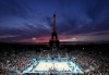 Canada's women's beach volleyball teammates Heather Bansley and Sophie Bukovec, left, warm up moments before the sun set and they played against United States teammates Kristen Ness and Taryn Kloth during the Paris Summer Olympics in Paris, France on Saturday, July 27 2024. THE CANADIAN PRESS/Nathan Denette