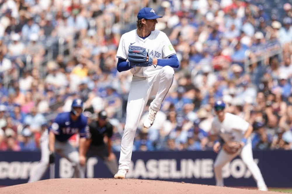 Toronto Blue Jays pitcher Kevin Gausman works against Texas Rangers during first inning American League MLB baseball action in Toronto on Saturday, July 27, 2024. THE CANADIAN PRESS/Chris Young