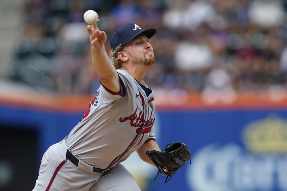Atlanta Braves pitcher Spencer Schwellenbach (56) delivers a pitch against the New York Mets during the third inning of a baseball game, Saturday, July 27, 2024, in New York. (AP Photo/Rich Schultz)