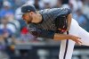 New York Mets pitcher Tylor Megill delivers against the Atlanta Braves during the first inning of a baseball game, Saturday, July 27, 2024, in New York. (AP Photo/Rich Schultz)