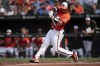Baltimore Orioles catcher Adley Rutschman (35) swing at the ball during the first inning of a baseball game against the San Diego Padres, Saturday, July 27, 2024, in Baltimore. (AP Photo/Jose Luis Magana)