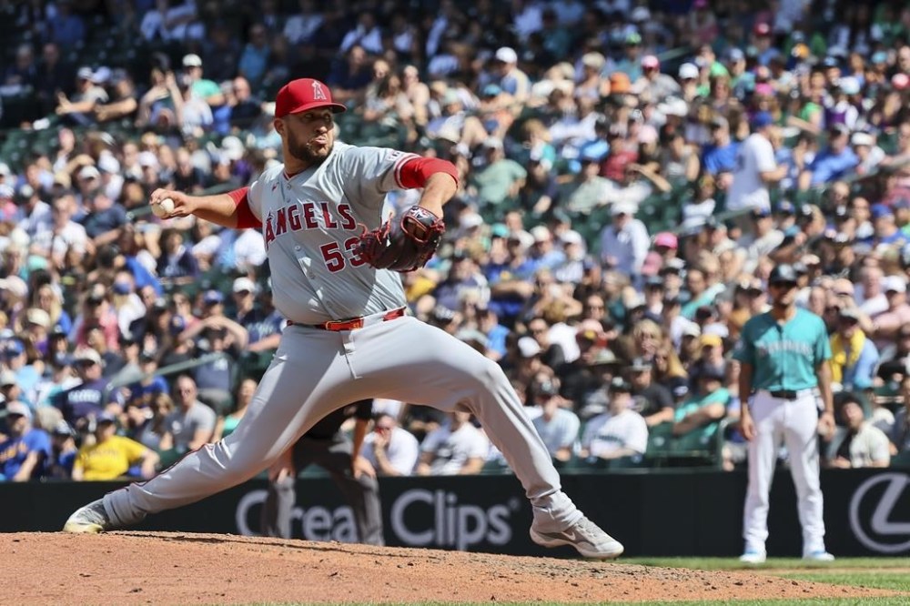 Los Angeles Angels pitcher Carlos Estévez pitches to close out the 2-1 win over the Seattle Mariners, Wednesday, July 24, 2024, in Seattle. (Kevin Clark/The Seattle Times via AP)