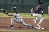 Arizona Diamondbacks' Jake McCarthy (31) beats the throw to Pittsburgh Pirates' Connor Joe (2) for a hit during the first inning of a baseball game, Saturday, July 27, 2024, in Phoenix. (AP Photo/Darryl Webb)