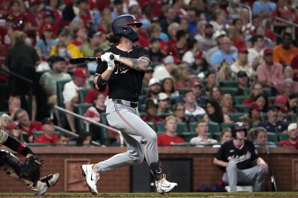 Washington Nationals' Jesse Winker hits an RBI single during the third inning of a baseball game against the St. Louis Cardinals Saturday, July 27, 2024, in St. Louis. (AP Photo/Jeff Roberson)