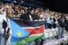 Fans are seen during a delay in the South Sudan national anthem prior to a men's basketball game against Puerto Rico at the 2024 Summer Olympics, Sunday, July 28, 2024, in Villeneuve-d'Ascq, France. (AP Photo/Michael Conroy)