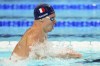 Leon Marchand, of France, competes during a heat in the men's 400-meter individual medley at the 2024 Summer Olympics, Sunday, July 28, 2024, in Nanterre, France. (AP Photo/Bernat Armangue)