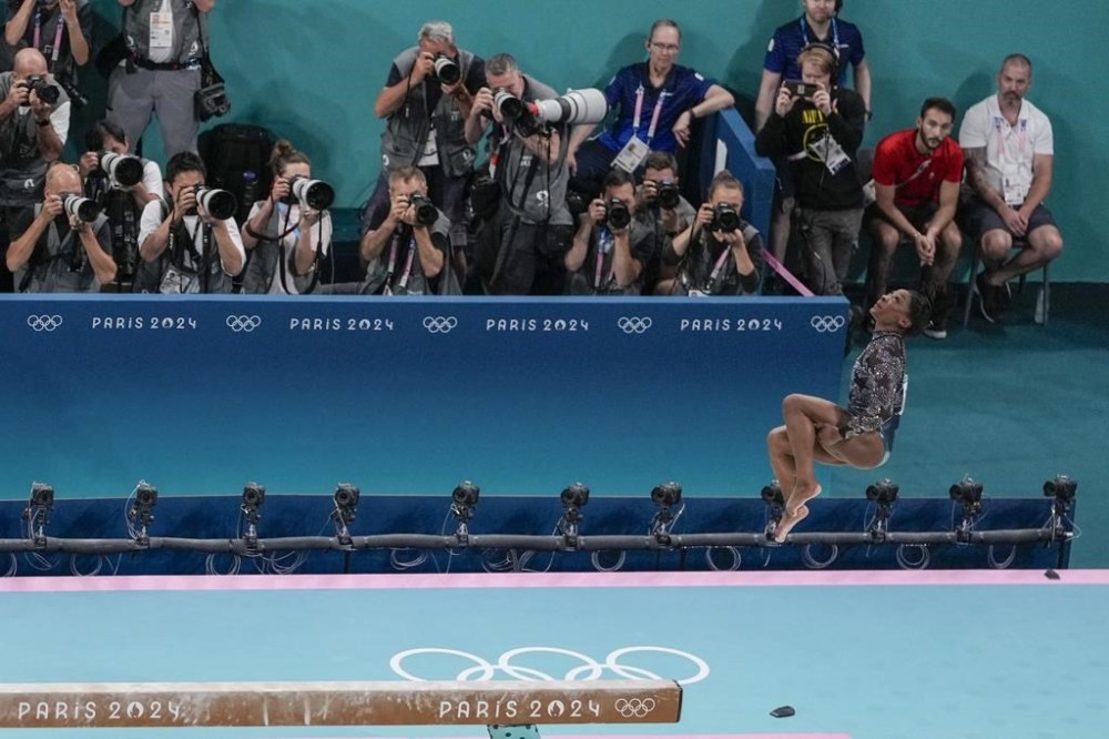 Simone Biles, of United States, performs on the beam during a women's artistic gymnastics qualification round at the 2024 Summer Olympics, Sunday, July 28, 2024, in Paris, France. (AP Photo/Morry Gash)
