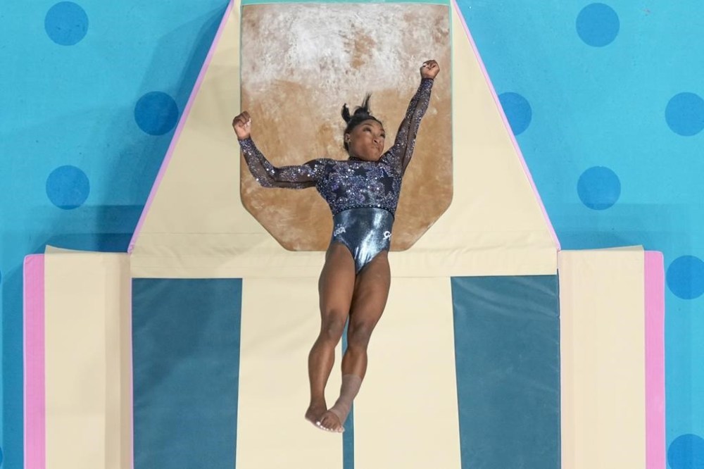Simone Biles, of United States, performs on the vault during a women's artistic gymnastics qualification round at the 2024 Summer Olympics, Sunday, July 28, 2024, in Paris, France. (AP Photo/Morry Gash)