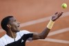 Canada's Felix Auger-Aliassime serves against Ben Shelton of the U.S. during their third round match of the French Open tennis tournament at the Roland Garros stadium in Paris, Friday, May 31, 2024. Auger-Aliassime and Bianca Andreescu started off Sunday’s matches at the Paris Olympics with straight-set victories. THE CANADIAN PRESS/AP/Jean-Francois Badias
