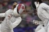 Canada's Eleanor Harvey, left, and China's Yuting Wang compete in the women's individual Foil round of 32 competition during the 2024 Summer Olympics at the Grand Palais, Sunday, July 28, 2024, in Paris, France. THE CANADIAN PRESS/AP/Andrew Medichini