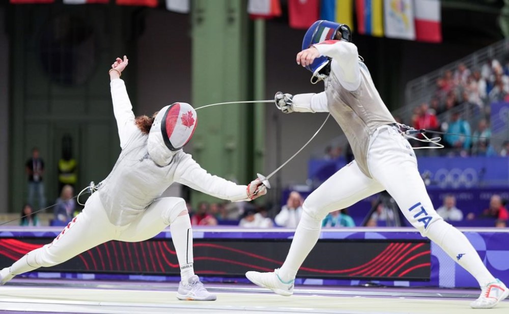 Eleanor Harvey of Canada competes against Martina Favaretto of Italy in the women's individual foil in Paris, France on Sunday, July 28, 2024. THE CANADIAN PRESS/Christinne Muschi