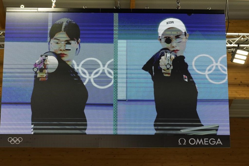 South Korea's Oh Ye-Jin, left, and Kim Yeji are seen on an electronic screen during the 10m air pistol women's final round at the 2024 Summer Olympics, Sunday, July 28, 2024, in Chateauroux, France. Oh Ye-Jin won the gold medal while Kim Yeji won the silver in the competition. (AP Photo/Manish Swarup)
