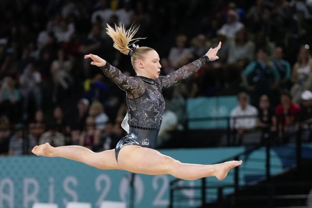 Jade Carey, of United States, competes on the floor exercise during a women's artistic gymnastics qualification round at the 2024 Summer Olympics, Sunday, July 28, 2024, in Paris, France. (AP Photo/Charlie Riedel)