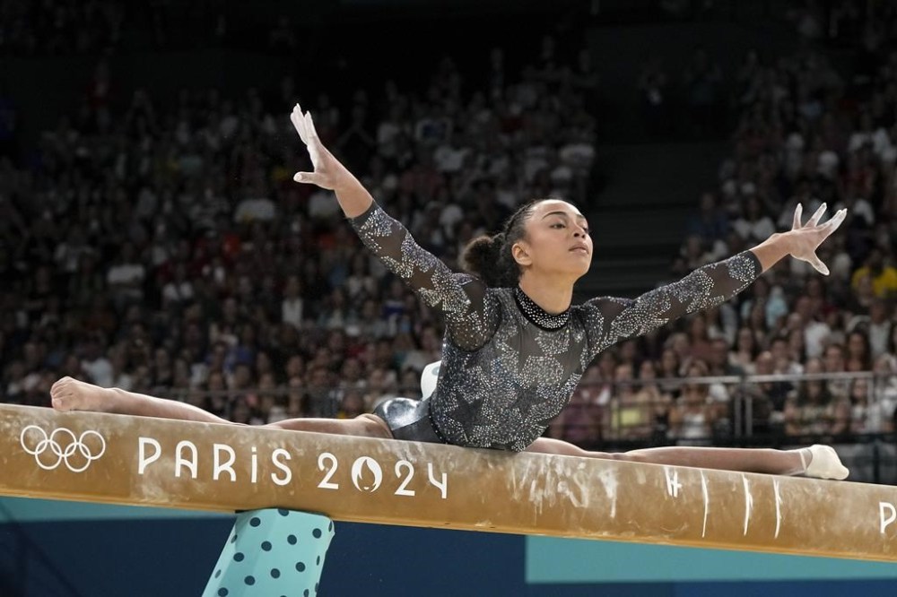 Hezly Rivera, of United States, competes on the balance beam during a women's artistic gymnastics qualification round at the 2024 Summer Olympics at Bercy Arena, Sunday, July 28, 2024, in Paris, France. (AP Photo/Charlie Riedel)