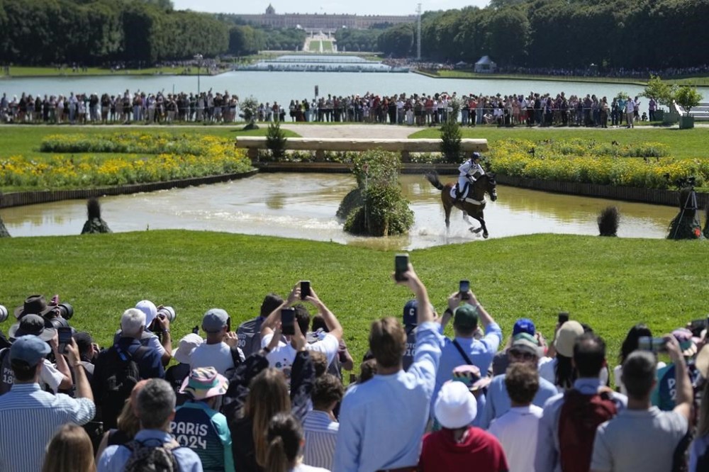 Britain's Laura Collett, riding London 52, during the Equestrian Cross Country competition at Chateau de Versailles for the 2024 Summer Olympics, Sunday, July 28, 2024, in Versailles, France. (AP Photo/Mosa'ab Elshamy)