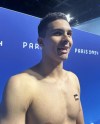 Palestinian swimmer Yazan Al Bawwab is interviewed at Paris La Defense Arena during the 2024 Summer Olympics in Nanterre, France, Sunday, July 28, 2024. (AP Photo/Janie McCauley)