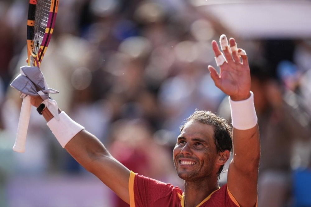 Rafael Nadal of Spain celebrates his victory over Marton Fucsovics of Hungary during the men's singles tennis competition, at the 2024 Summer Olympics, Sunday, July 28, 2024, in Paris, France. (AP Photo/Manu Fernandez)