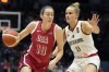 United States' Breanna Stewart, left, drives around Germany's Leonie Fiebich during a women's exhibition basketball game between the United States and Germany at the O2 Arena in London, Tuesday, July 23, 2024. (AP Photo/Alastair Grant)