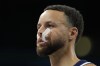 Stephen Curry, of the United States, stands on the court in a men's basketball game against Serbia at the 2024 Summer Olympics, Sunday, July 28, 2024, in Villeneuve-d'Ascq, France. (AP Photo/Michael Conroy)