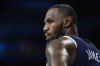 LeBron James, of the United States, stands on the court during a men's basketball game against Serbia at the 2024 Summer Olympics, Sunday, July 28, 2024, in Villeneuve-d'Ascq, France. (AP Photo/Michael Conroy)