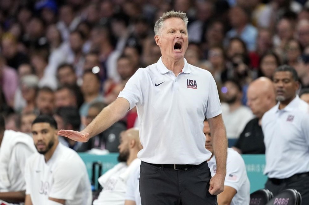 United States head coach Steve Kerr gestures in a men's basketball game against Serbia at the 2024 Summer Olympics, Sunday, July 28, 2024, in Villeneuve-d'Ascq, France. (AP Photo/Michael Conroy)