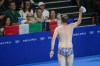 A lifeguard gestures to the crowd after retrieving United States swimmer Emma Webber's swimming cap that happened to have been left at the bottom of the pool during the morning session at the 2024 Summer Olympics, Sunday, July 28, 2024, in Nanterre, France. (AP Photo/Petr David Josek)