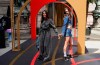U.S. former swimmer Janet Evans, left, wears a creation by Veronique Leroy and her daughter Sydney Wilson wears a creation by Marine Serre and Sneex footwear, during the first gender equal Olympic Games fashion show, at the 2024 Summer Olympics in Paris, France, Sunday, July 28, 2024. To celebrate gender equality at the Olympics, PARITY Paris hosted a runway show in conjunction with the Coca-Cola House. (AP Photo/Michel Euler)