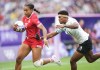 Canada back Keyara Wardley (12) scores a try past Fiji back Maria Rokotuisiga (11) during second half Women rugby 7s rugby action at the Paris Summer Olympics in Paris, France on Sunday, July 28, 2024. THE CANADIAN PRESS/Nathan Denette