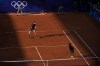 Andy Murray and Daniel Evans of Britain play against Kei Nishikori and Toro Daniel of Japan during the men's doubles tennis competition, at the 2024 Summer Olympics, Sunday, July 28, 2024, in Paris, France. (AP Photo/Andy Wong)