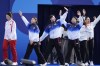 South Korea arrives for the medal ceremony during Archery at the 2024 Summer Olympics, Sunday, July 28, 2024, in Paris, France. (AP Photo/Rebecca Blackwell)