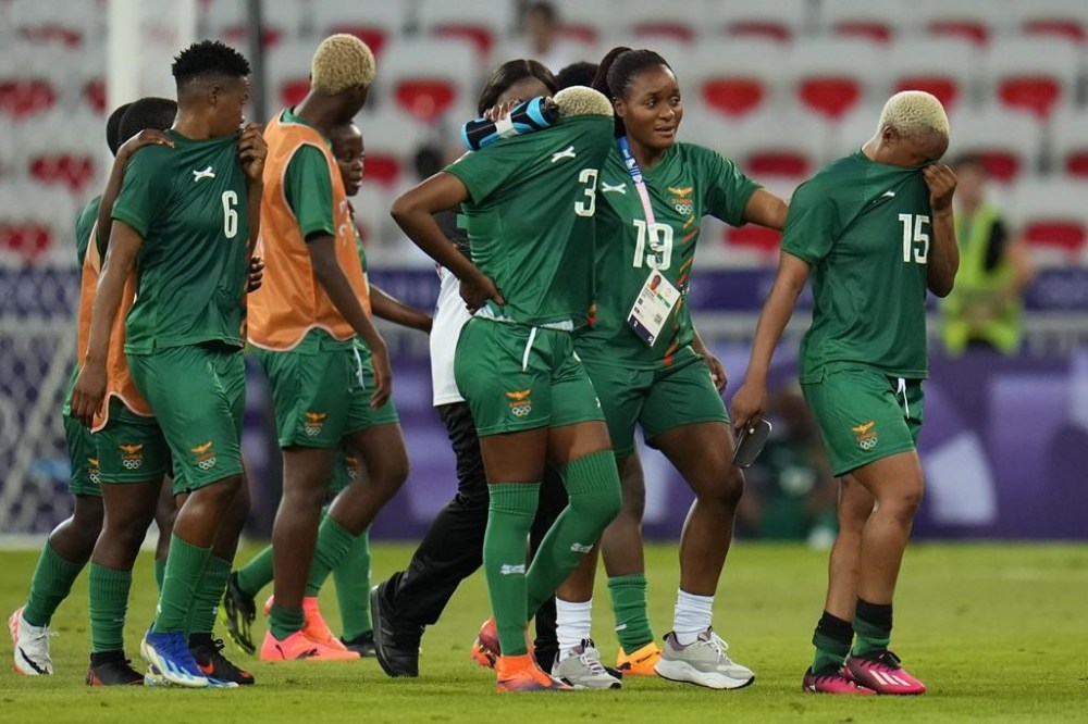 Zambia's players leave the pitch after losing 5-6 against Australia during a women's group B soccer match at the 2024 Summer Olympics, Sunday, July 28, 2024, in Nice, France. (AP Photo/Julio Cortez)