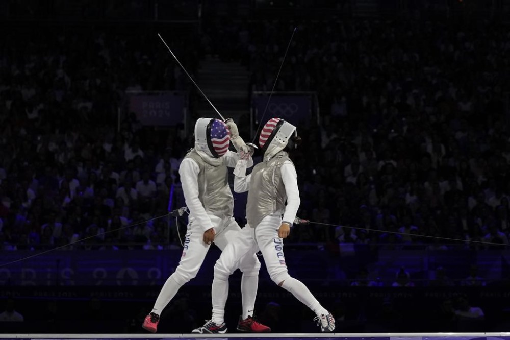 United States' Lee Kiefer, right, competes with United States' Lauren Scruggs in the women's individual Foil final match during the 2024 Summer Olympics at the Grand Palais, Sunday, July 28, 2024, in Paris, France. (AP Photo/Andrew Medichini)