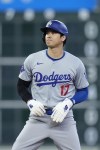 Los Angeles Dodgers designated hitter Shohei Ohtani stands after stealing second base during the ninth inning of a baseball game against the Houston Astros, Sunday, July 28, 2024, in Houston. (AP Photo/Kevin M. Cox)