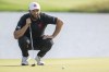 Captain Jon Rahm, of Legion XIII, reads his putt on the 13th hole during the final round of LIV Golf United Kingdom by JCB at JCB Golf & Country Club, Sunday, July 28, 2024, in Rocester, England. (Charles Laberge/LIV Golf via AP)