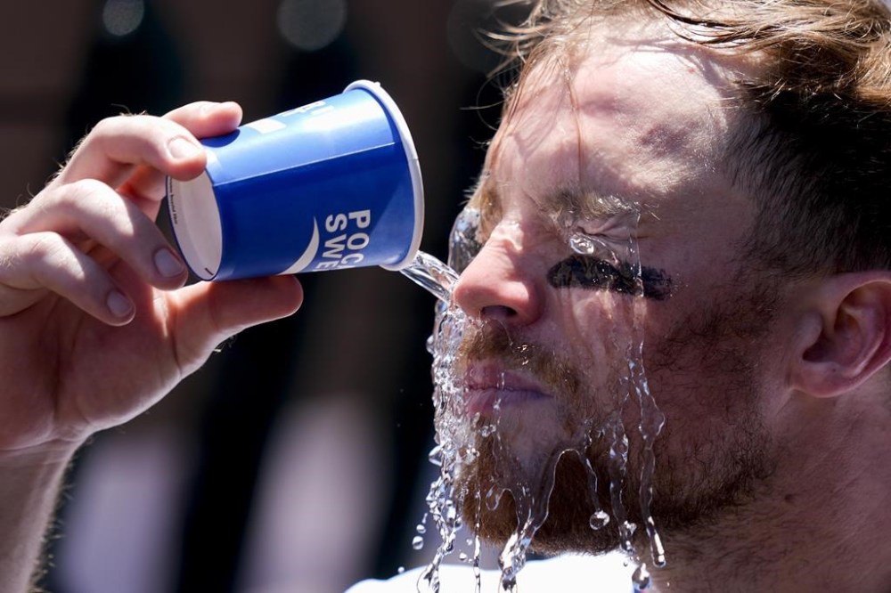 Los Angeles Angels second baseman Brandon Drury cools off during the second inning of a baseball game against the Oakland Athletics, Sunday, July 28, 2024, in Anaheim, Calif. (AP Photo/Ryan Sun)