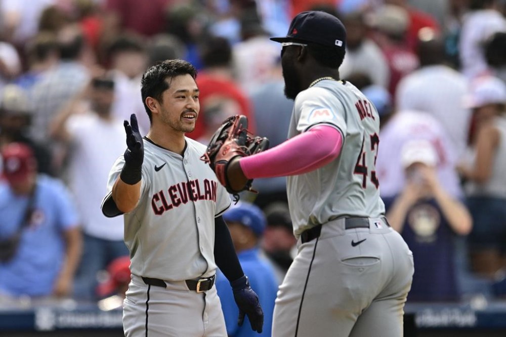 Cleveland Guardians' Steven Kwan, left, and Jhonkensy Noel, right, celebrate after their victory over the Philadelphia Phillies, Sunday, July 28, 2024, in Philadelphia. (AP Photo/Derik Hamilton)