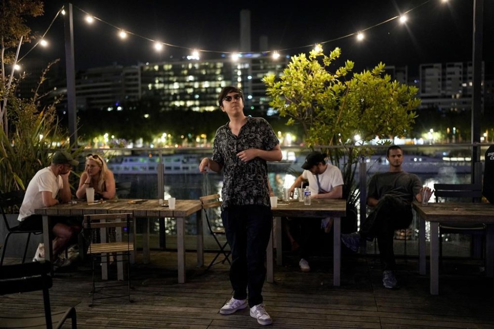 A person dances during the DiscOlympics at Wanderlust night club during the 2024 Summer Olympics, Monday, July 29, 2024, in Paris, France. The legendary French disco artist Cerrone, played at the DiscOlympics which paid homage to the root of dance music. (AP Photo/Natacha Pisarenko)