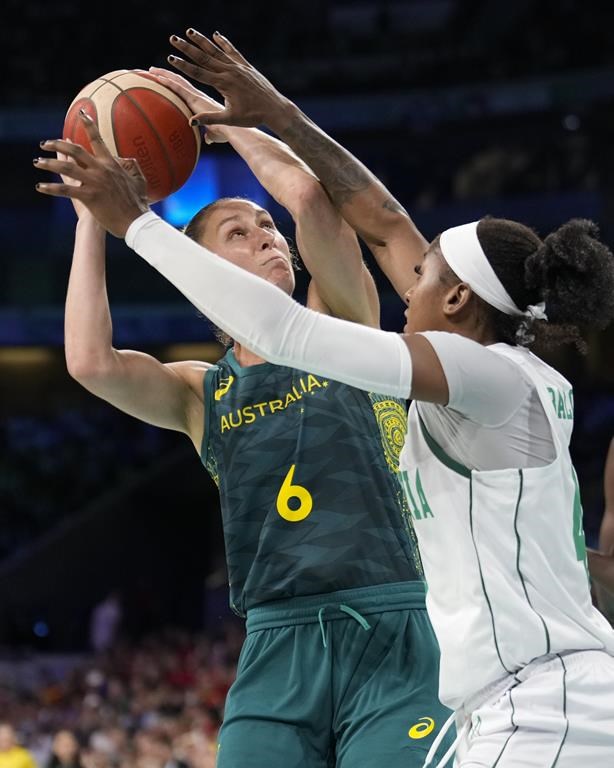 Steph Talbot, of Australia, shoots over Elizabeth Balogun, of Nigeria, in a women's basketball game at the 2024 Summer Olympics, Monday, July 29, 2024, in Villeneuve-d'Ascq, France. (AP Photo/Mark J. Terrill)