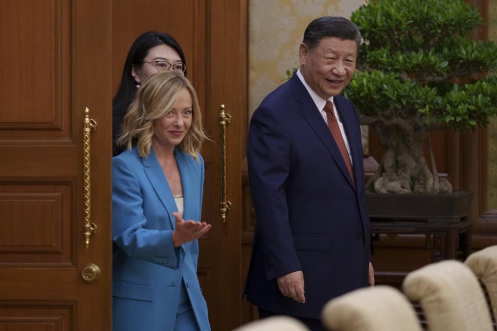 Chinese President Xi Jinping, right, walks with Italian Premier Giorgia Meloni, left, for a meeting at the Diaoyutai State Guesthouse in Beijing, China, Monday, July 29, 2024. (AP Photo/Vincent Thian, Pool)