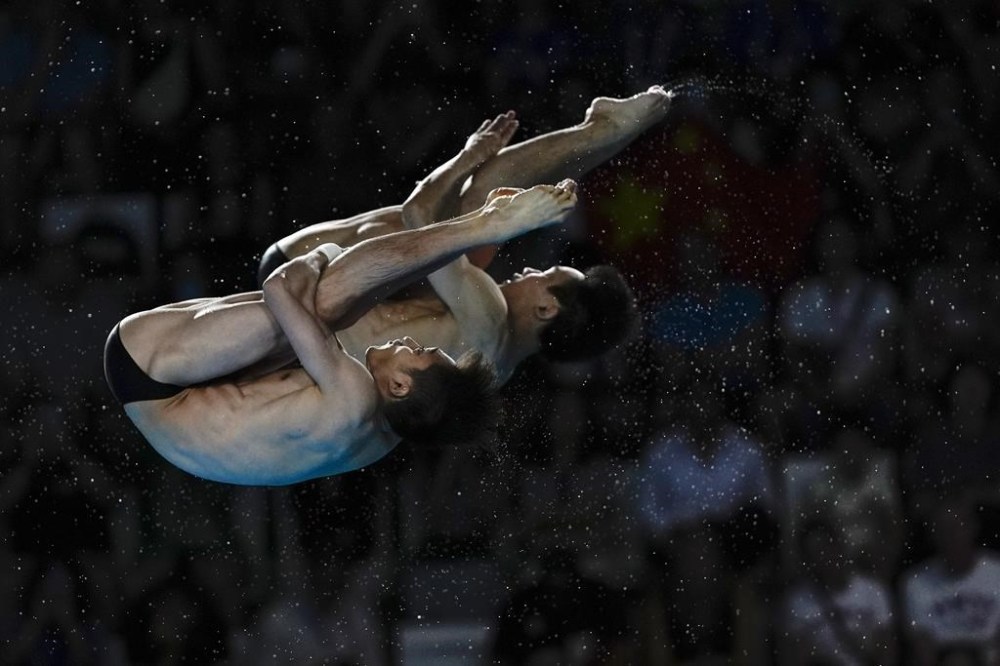 China's Lian Junjie and Yang Hao compete in the men's synchronised 10m platform diving final at the 2024 Summer Olympics, Monday, July 29, 2024, in Saint-Denis, France. (AP Photo/Lee Jin-man)