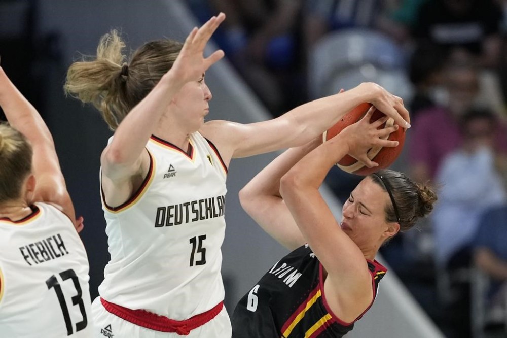 Luisa Geiselsoder, of Germany, blocks the shot of Antonia Delaere, of Belgium, in a women's basketball game at the 2024 Summer Olympics, Monday, July 29, 2024, in Villeneuve-d'Ascq, France. (AP Photo/Mark J. Terrill)