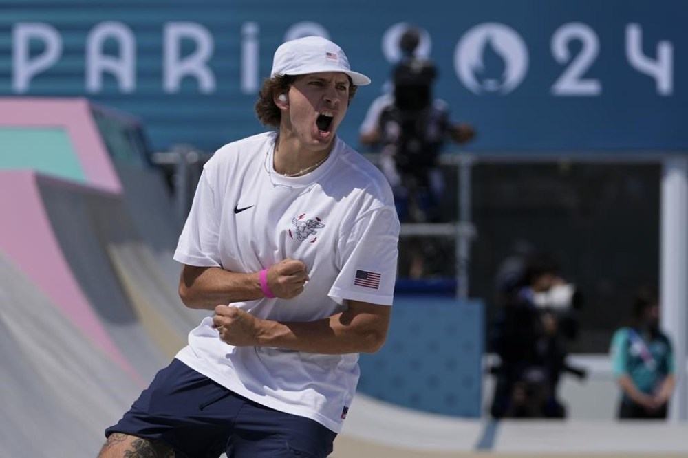 Jagger Eaton, of the United States, celebrates landing a trick the men's skateboard street preliminaries at the 2024 Summer Olympics, Monday, July 29, 2024, in Paris, France. (AP Photo/Frank Franklin II)
