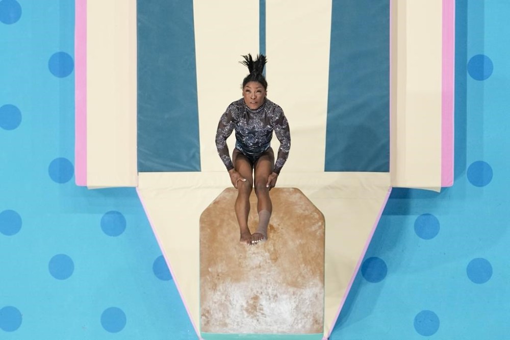 Simone Biles, of United States, performs on the vault during a women's artistic gymnastics qualification round at the 2024 Summer Olympics, Sunday, July 28, 2024, in Paris, France. (AP Photo/Morry Gash)
