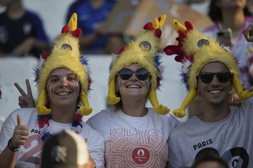 French fans wait for the women's Group A soccer match between Canada and France at Geoffroy-Guichard stadium during the 2024 Summer Olympics, Sunday, July 28, 2024, in Saint-Etienne, France. (AP Photo/Silvia Izquierdo)