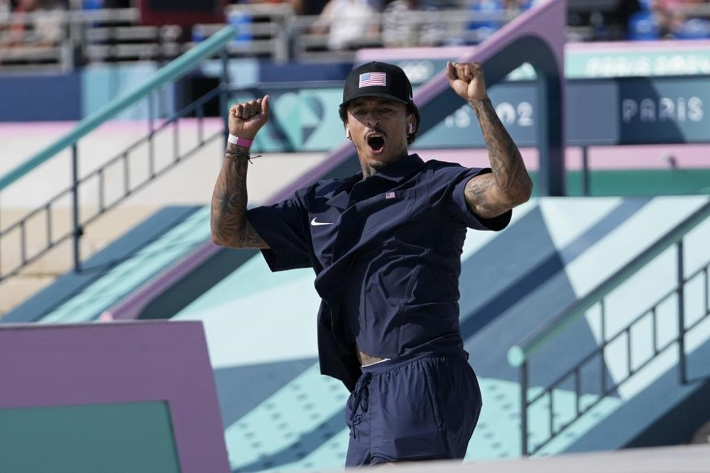 Nyjah Huston, of the United States, celebrates after his second run during the men's skateboard street final at the 2024 Summer Olympics, Monday, July 29, 2024, in Paris, France. (AP Photo/Frank Franklin II)