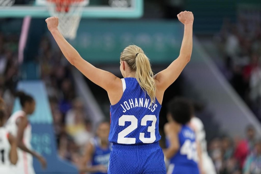 Marine Johannes, of France, celebrates in a women's basketball game against Canada at the 2024 Summer Olympics, Monday, July 29, 2024, in Villeneuve-d'Ascq, France. (AP Photo/Mark J. Terrill)